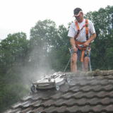 Mosmatic Roof Cleaner Application being lowered on a roof