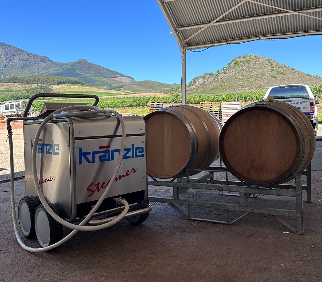 Kr&auml;nzle Steamer beside wine barrels on a Western Cape wine farm
